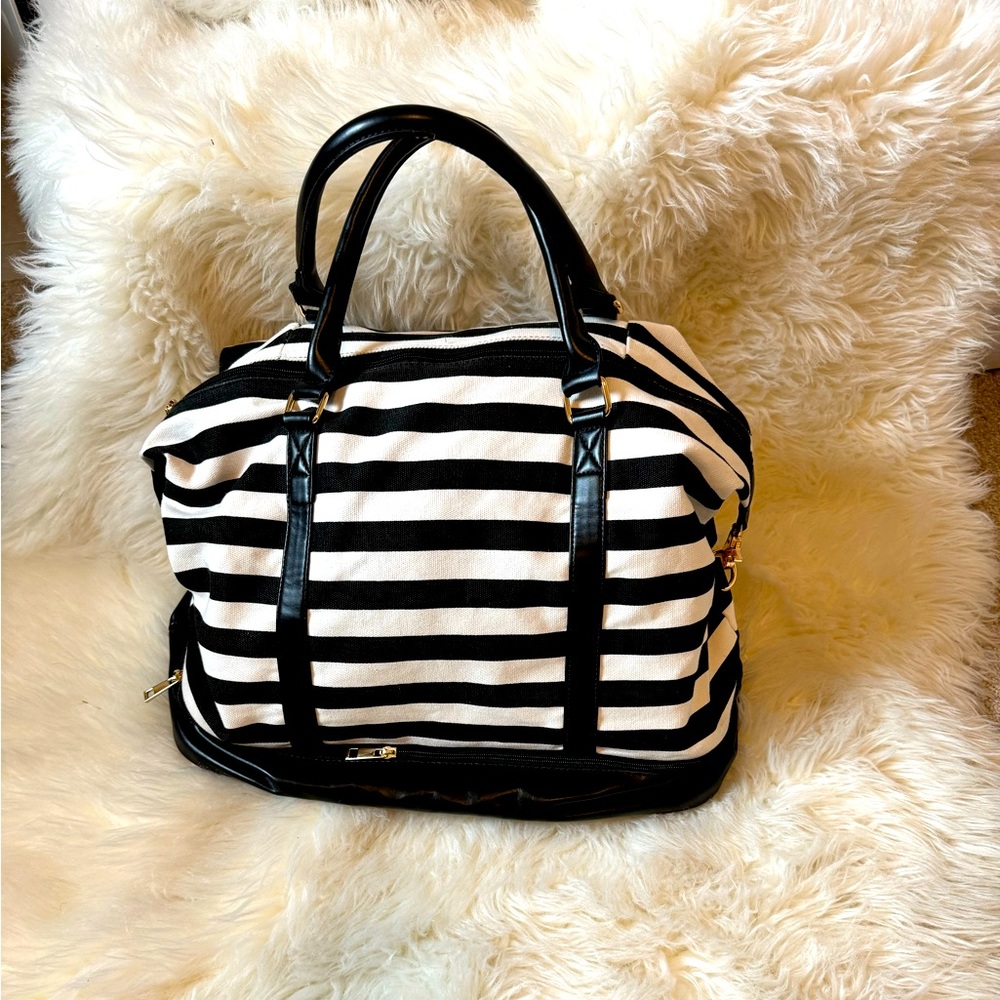Black and white canvas travel bag with shoe compartment